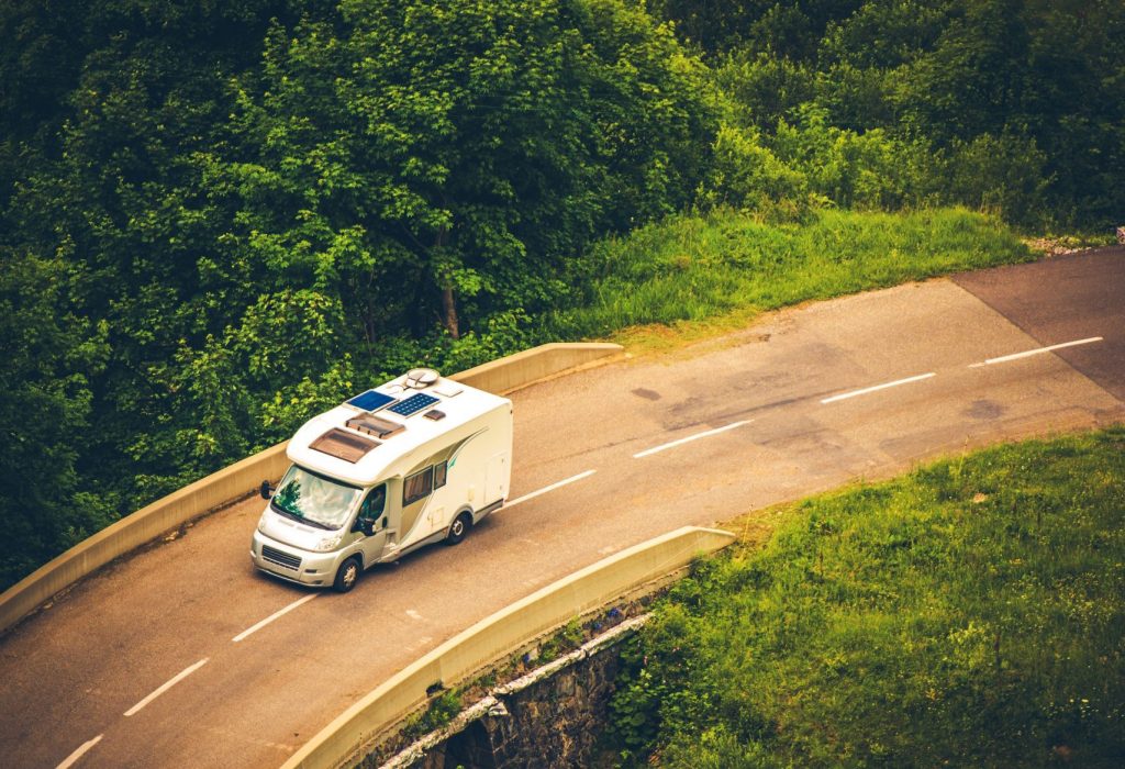 Motorhome driving on the road. Campervan Finance page featured image